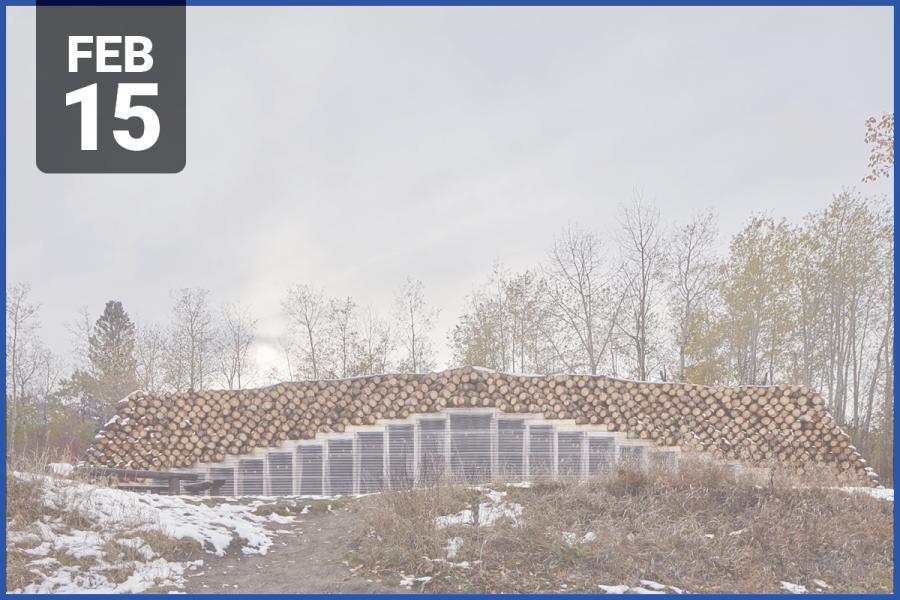 Image of structure with log roof in an autumn landscape.